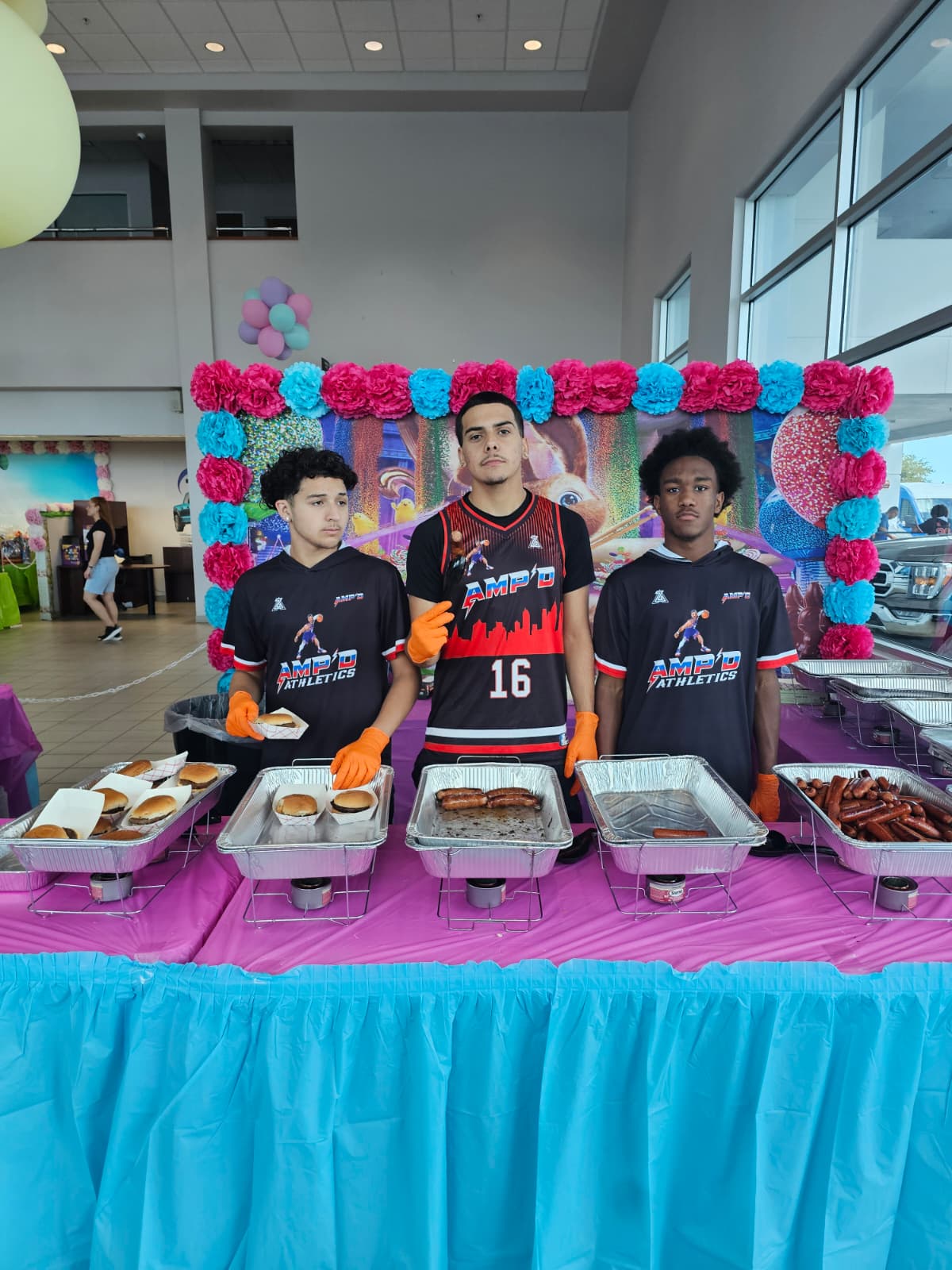 AMPD players behind the food table at the Jarrett Gordon Ford fundraiser